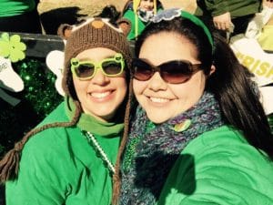 Two woman wearing sunglasses and Irish sunglasses. 